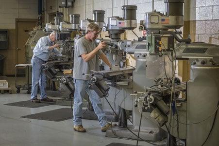 rodon employees use manufacturing equipment in the facility
