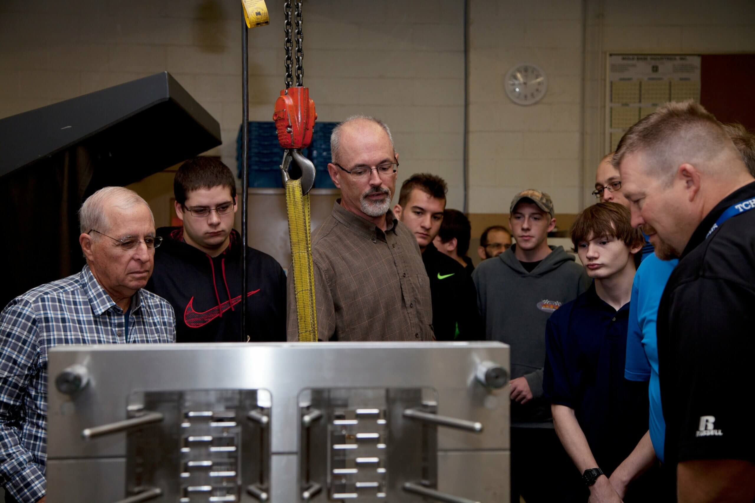 Mike_B_with_students.jpg Rodon employee shows a group of students a plastic injection mold