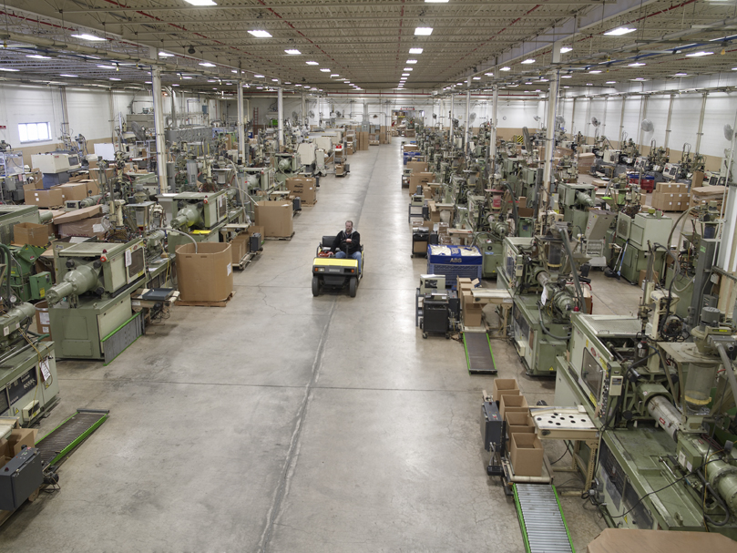 The Triple Threat: How Domestic Automated Molding Shields Your Supply Chain from Tariffs, Sea Disruptions, and Freight Inflation